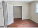 Simple bedroom with wood flooring and closet at 1030 Mundys Mill Rd, Jonesboro, GA 30238