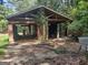 Detached garage with double doors, showing signs of age and disrepair at 1030 Mundys Mill Rd, Jonesboro, GA 30238