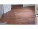 Simple living room with wood-look flooring at 1030 Mundys Mill Rd, Jonesboro, GA 30238