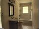 Clean bathroom with bathtub, toilet, and vanity at 1030 Mundys Mill Rd, Jonesboro, GA 30238