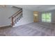 Spacious living room with carpet and sliding glass doors at 3482 Sweetgum Ln, Decatur, GA 30032