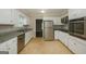 Modern kitchen with granite countertops and stainless steel appliances at 1551 Adrian Dr, Riverdale, GA 30296