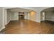 Spacious living room featuring a brick fireplace and hardwood floors at 1551 Adrian Dr, Riverdale, GA 30296