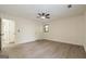 Light-filled bedroom with ceiling fan and hardwood floors at 216 Colemans Bluff Dr, Woodstock, GA 30188