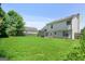Spacious backyard with a large grassy area at 3463 Madison Farm Way, Snellville, GA 30039