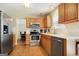 Kitchen features stainless steel appliances and wood cabinetry at 3463 Madison Farm Way, Snellville, GA 30039
