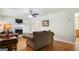 Living room with fireplace, hardwood floors and lots of natural light at 3463 Madison Farm Way, Snellville, GA 30039