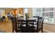 Charming dining area with wood floors and breakfast bar at 3463 Madison Farm Way, Snellville, GA 30039