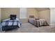 Bright bedroom featuring two twin beds, ideal for guests or children at 3463 Madison Farm Way, Snellville, GA 30039