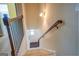 Elegant staircase with iron railings leading to the upper level at 445 Brickstone Way, Covington, GA 30016