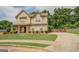 Two-story house with a large yard and driveway at 445 Brickstone Way, Covington, GA 30016