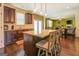 Kitchen with granite island, dark wood cabinets and stainless steel appliances at 445 Brickstone Way, Covington, GA 30016