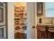 Walk-in pantry with ample shelving for food storage at 445 Brickstone Way, Covington, GA 30016