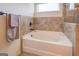 Bathroom with soaking tub and shower at 445 Brickstone Way, Covington, GA 30016