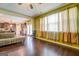 Spacious living room with hardwood floors and view of kitchen at 445 Brickstone Way, Covington, GA 30016