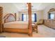Main bedroom with a king-size bed, dresser, and chaise lounge at 445 Brickstone Way, Covington, GA 30016