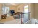 Open living area with sectional sofa and balcony access at 445 Brickstone Way, Covington, GA 30016