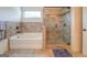 Bathroom with soaking tub and separate shower stall at 445 Brickstone Way, Covington, GA 30016