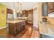 Kitchen island with granite countertop and seating for three at 445 Brickstone Way, Covington, GA 30016