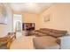 Bright bonus room features a sectional sofa and large TV at 445 Brickstone Way, Covington, GA 30016