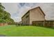 Large backyard with privacy fence and green lawn at 445 Brickstone Way, Covington, GA 30016