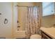 Bathroom with shower/tub combo and patterned shower curtain at 445 Brickstone Way, Covington, GA 30016