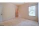 Simple bedroom with neutral walls and carpeting at 445 Brickstone Way, Covington, GA 30016