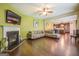 Open living room with fireplace and view into kitchen at 445 Brickstone Way, Covington, GA 30016