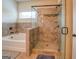 Bathroom with soaking tub and separate shower stall at 445 Brickstone Way, Covington, GA 30016