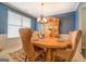 Formal dining room with a large table and elegant chandelier at 445 Brickstone Way, Covington, GA 30016