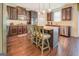 Modern kitchen with dark wood cabinets, granite countertops and stainless steel appliances at 445 Brickstone Way, Covington, GA 30016