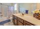 Bathroom with shower/tub combo and dark wood vanity at 445 Brickstone Way, Covington, GA 30016