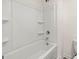 Clean bathroom with a shower/tub combo and shelving at 512 Whitman Lane # 2004, Stockbridge, GA 30281