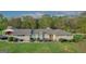 Ranch style home with carport and landscaped yard at 5325 Browns Bridge Rd, Cumming, GA 30041