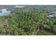 Aerial view of large wooded lot near a lake and highway at 5325 Browns Bridge Rd, Cumming, GA 30041