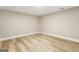 Spacious finished basement with light wood flooring at 1510 Mims Sw St, Atlanta, GA 30314