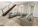 Finished basement featuring a sitting area and a modern staircase at 1510 Mims Sw St, Atlanta, GA 30314