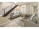 Finished basement with comfortable seating and a modern staircase at 1510 Mims Sw St, Atlanta, GA 30314