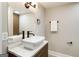Modern half bathroom with vessel sink and wood vanity at 1510 Mims Sw St, Atlanta, GA 30314