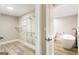 Spa-like bathroom with walk-in closet and soaking tub at 1510 Mims Sw St, Atlanta, GA 30314