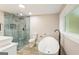 Modern bathroom with walk-in shower and freestanding tub at 1510 Mims Sw St, Atlanta, GA 30314