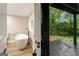 Modern bathroom with freestanding tub and access to deck at 1510 Mims Sw St, Atlanta, GA 30314