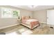 Charming bedroom with two windows and wood floors at 1510 Mims Sw St, Atlanta, GA 30314