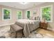 Comfortable bedroom with a queen bed and ample natural light at 1510 Mims Sw St, Atlanta, GA 30314