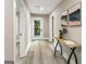 Light-filled hallway with hardwood floors and access to backyard at 1510 Mims Sw St, Atlanta, GA 30314