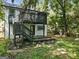 Modern home with a deck and stairs leading to a backyard at 1510 Mims Sw St, Atlanta, GA 30314