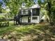 Modern home with a deck and stairs leading to a backyard at 1510 Mims Sw St, Atlanta, GA 30314