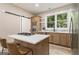 Modern kitchen with island, stainless steel appliances, and farmhouse sink at 1510 Mims Sw St, Atlanta, GA 30314