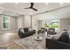Open living room featuring hardwood floors and large windows at 1510 Mims Sw St, Atlanta, GA 30314