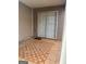 Small patio with checkered tile flooring and sliding door access at 449 Kara Ln, Mcdonough, GA 30253
